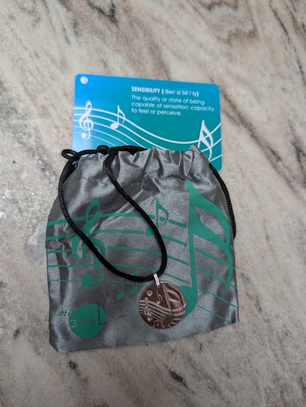 Musical Note Pendant Necklace with Gray & Teal Drawstring Pouch